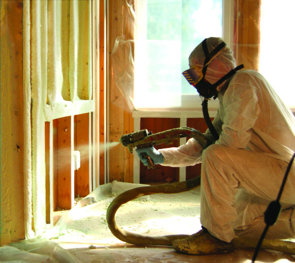 spray foam insulation being installed by a technician